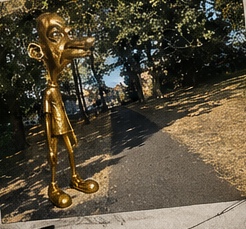 Neegy standing outside on a street path